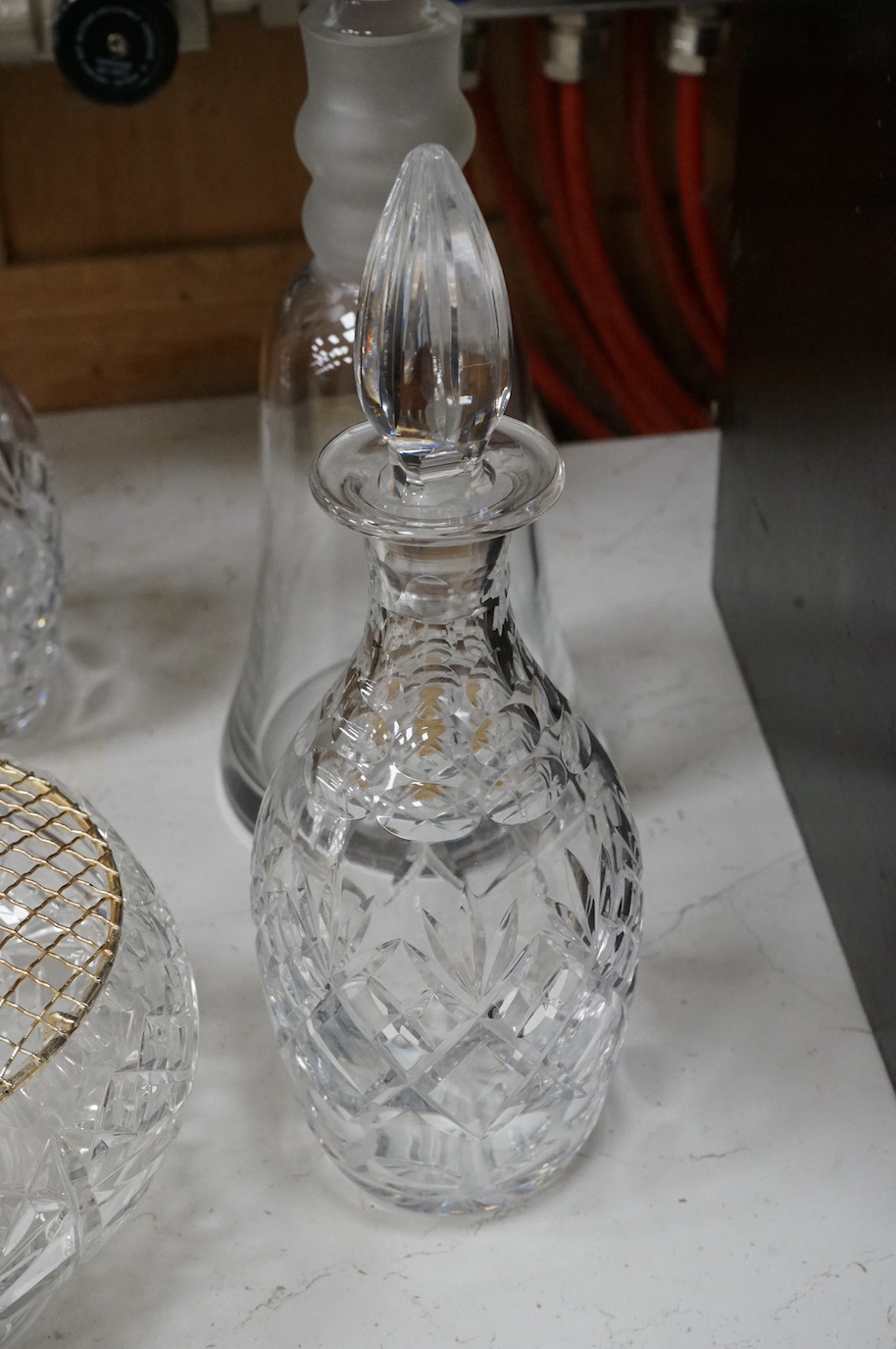 A Webb Corbett bowl, two decanters and another decanter, largest 30cm high